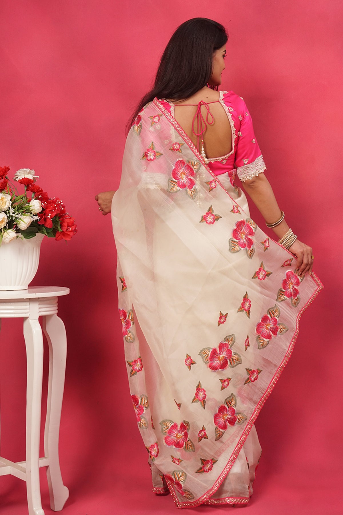 Off white organza floral embroidered saree with pink designer blouse