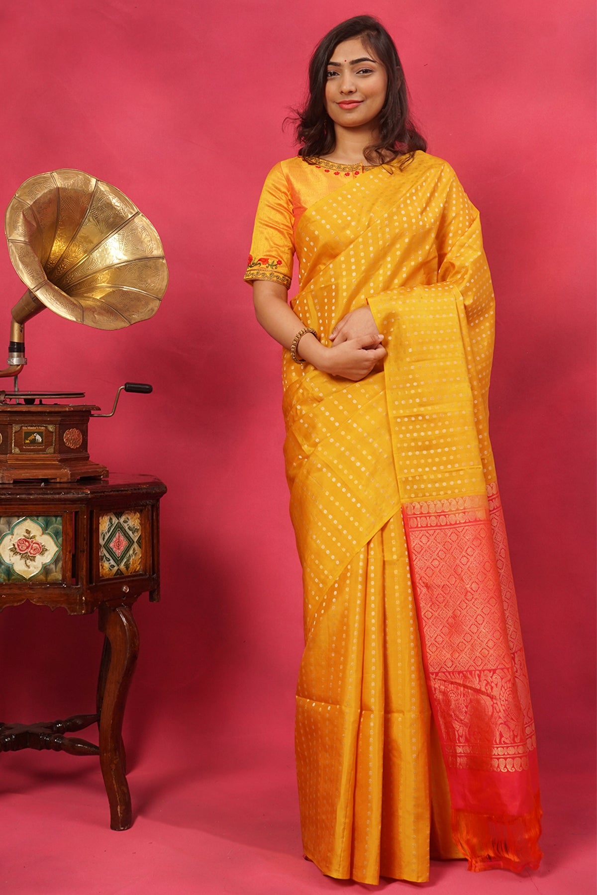 Yellow pure silk in gold buttas with contrast pallu.