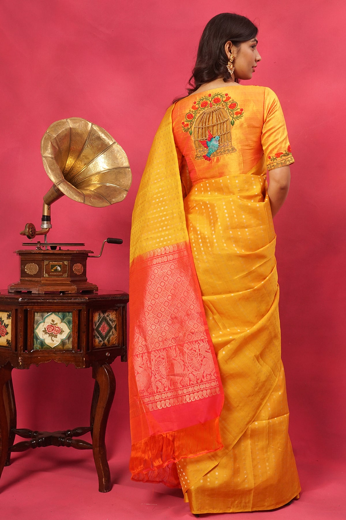 Yellow pure silk in gold buttas with contrast pallu.
