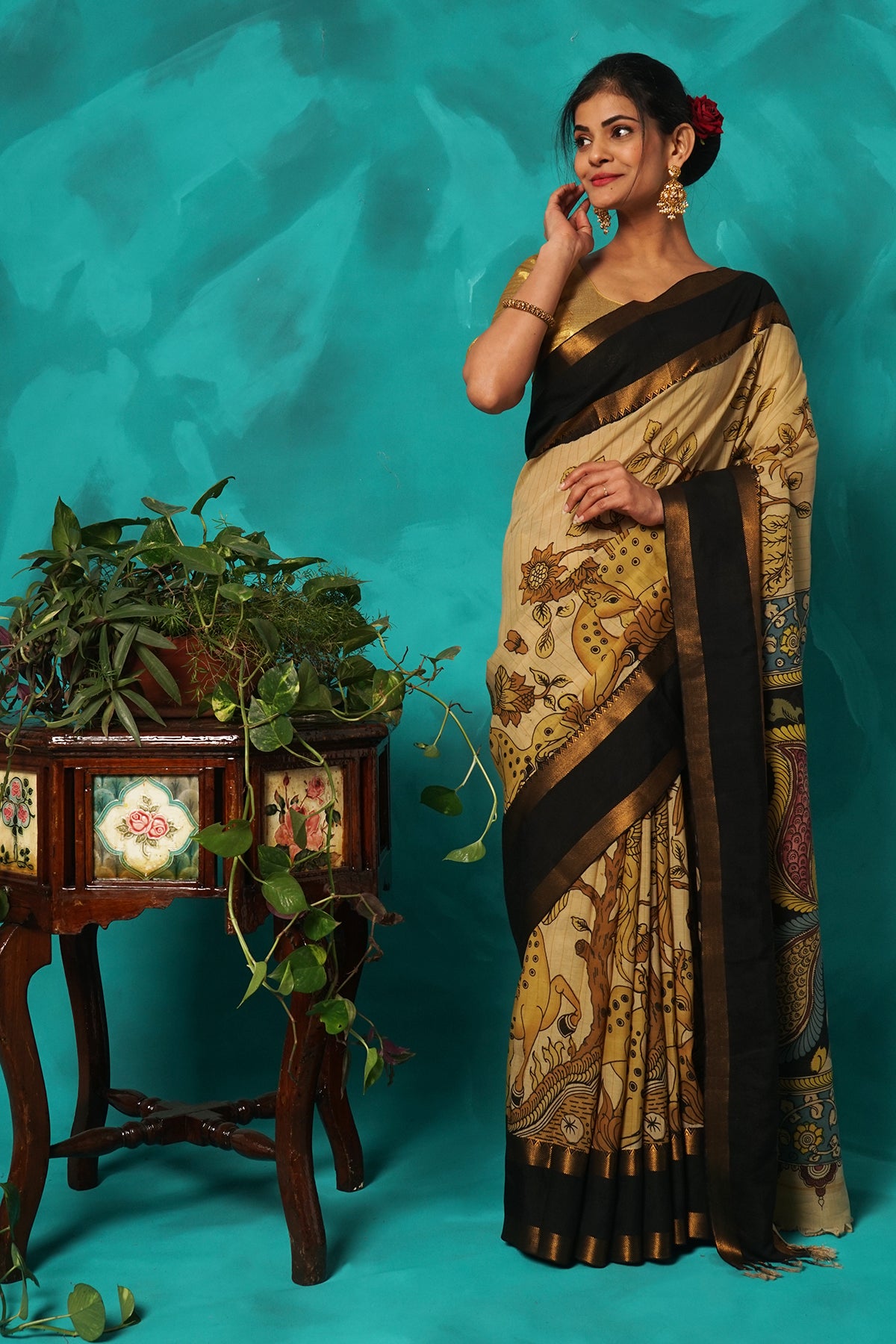 Beige hand kalamkari painted silk saree.