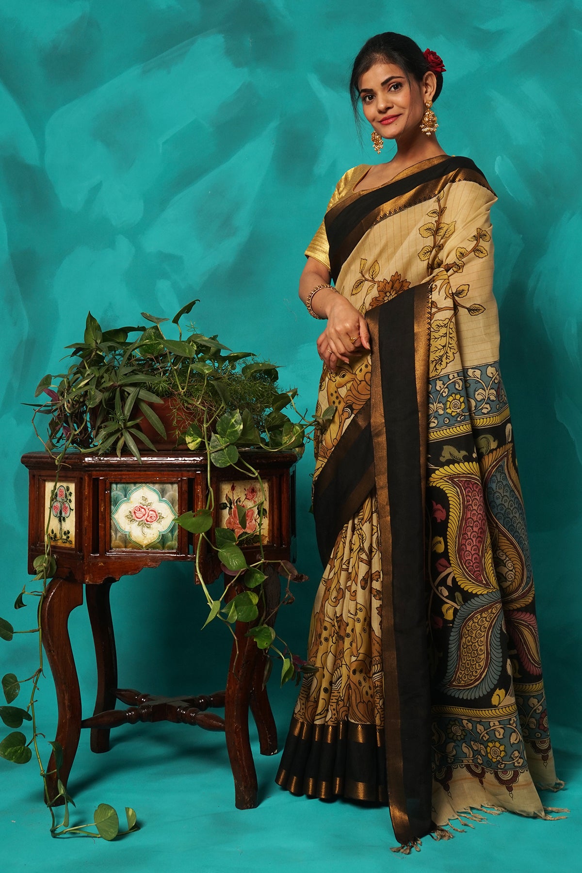 Beige hand kalamkari painted silk saree.