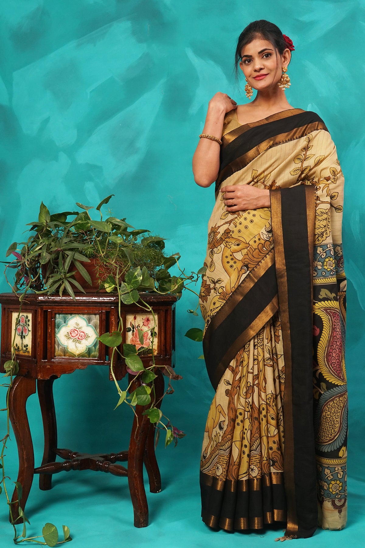 Beige hand kalamkari painted silk saree.