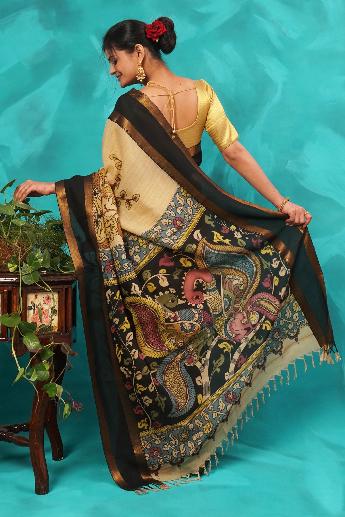 Beige hand kalamkari painted silk saree.