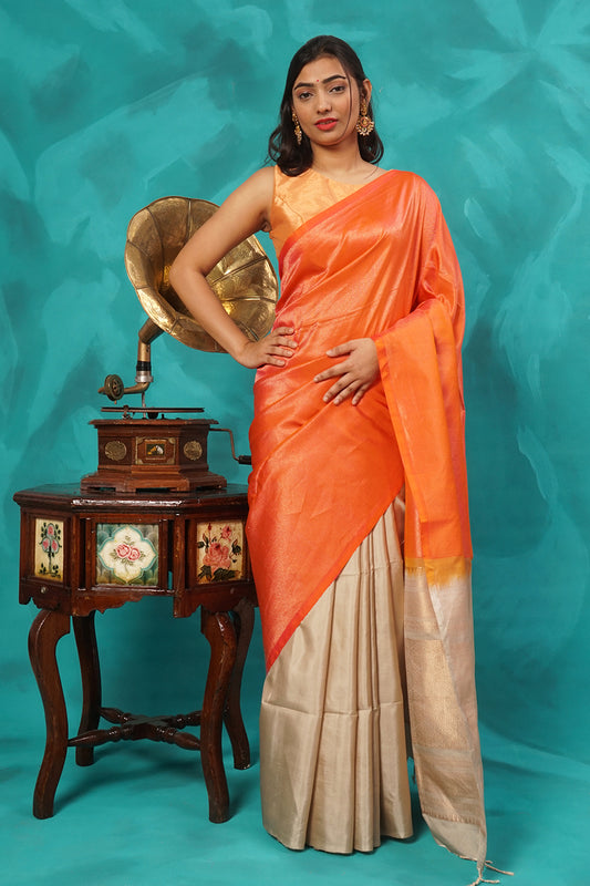 Orange and beige zari woven pure silk saree.