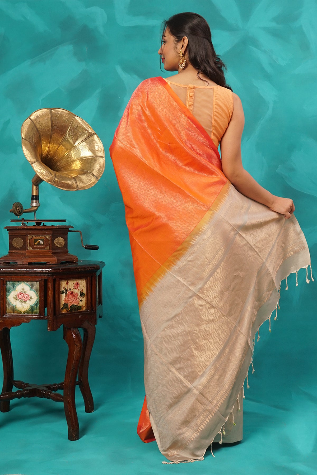 Orange and beige zari woven pure silk saree.