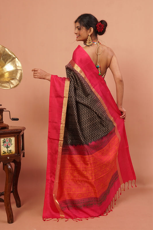 Black woven handloom silk with pink and gold border.