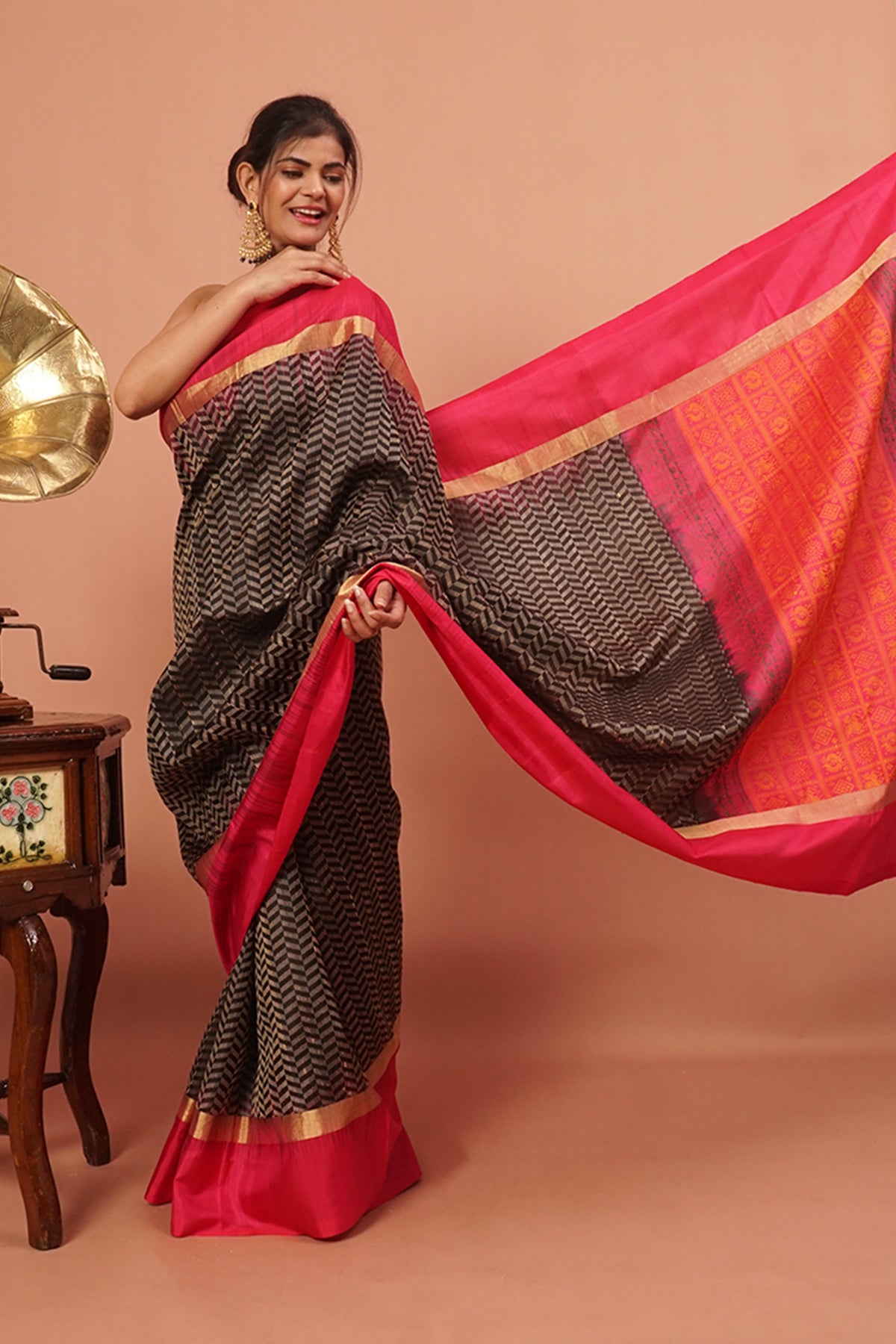 Black woven handloom silk with pink and gold border.