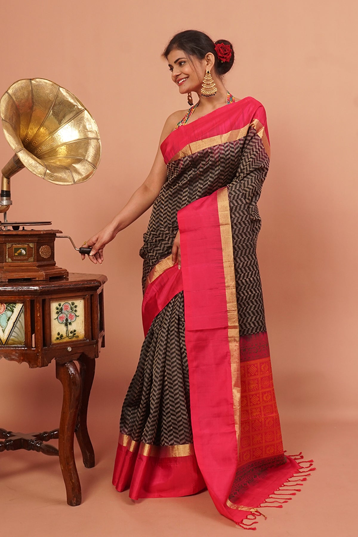 Black woven handloom silk with pink and gold border.