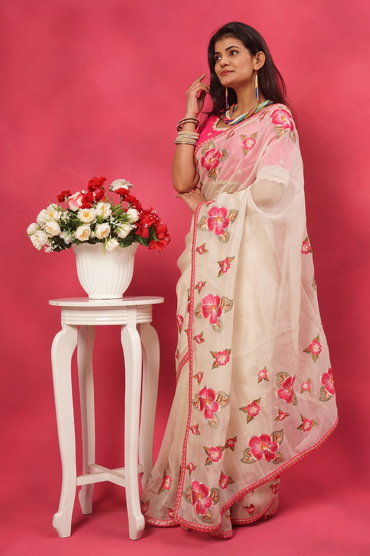 Off white organza floral embroidered saree with pink designer blouse