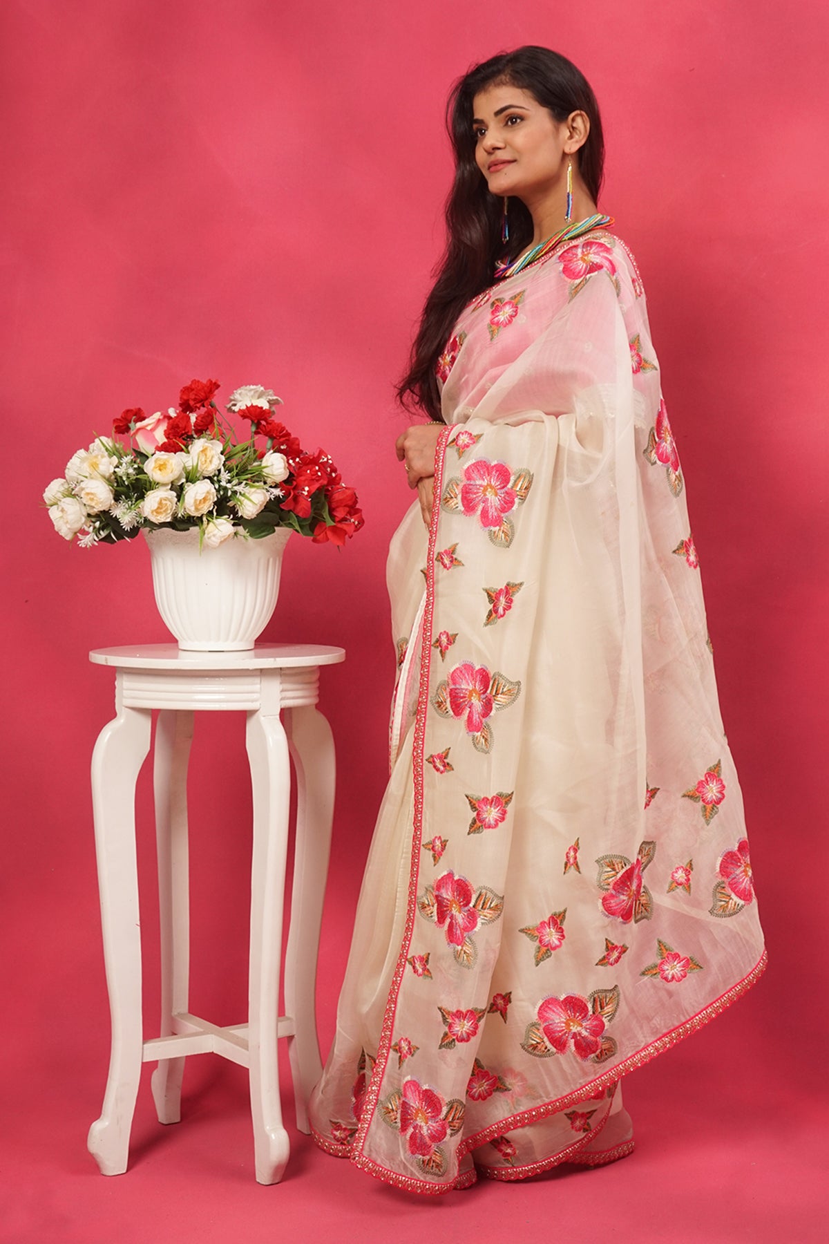 Off white organza floral embroidered saree with pink designer blouse